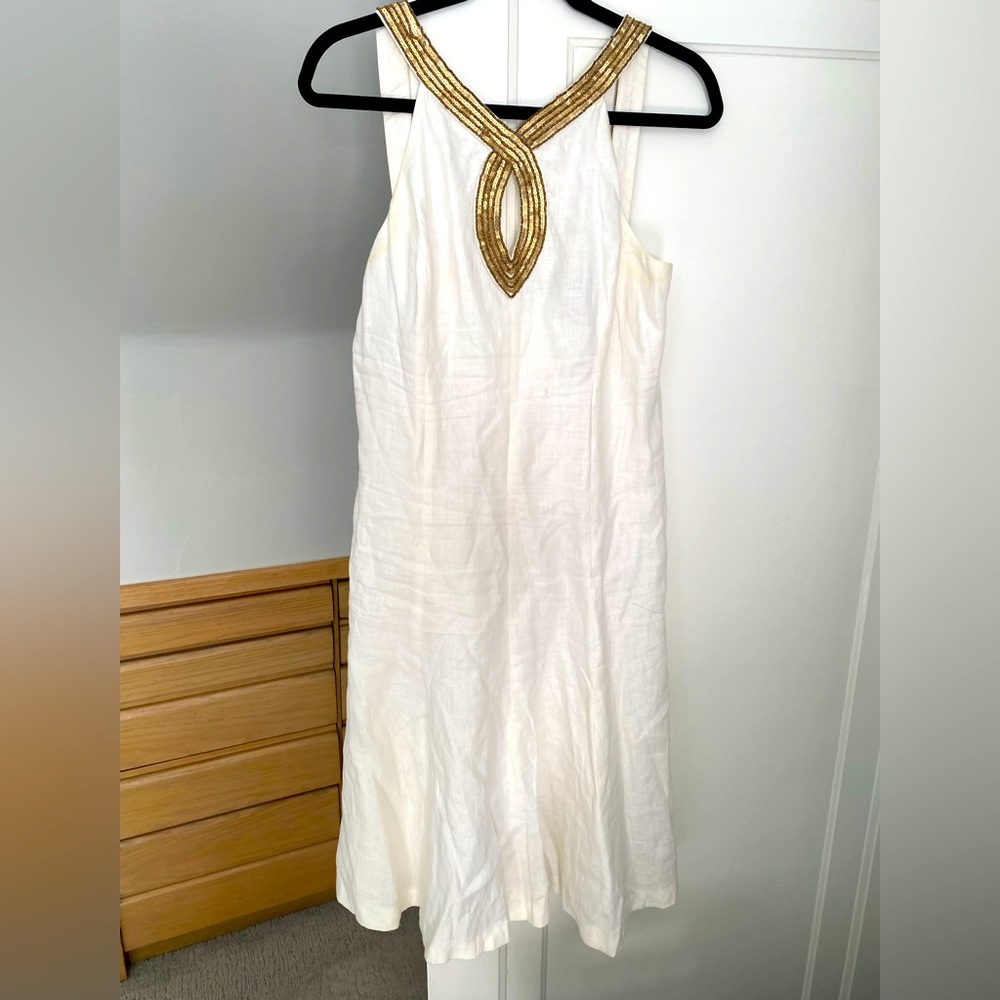 White linen dress with gold trim